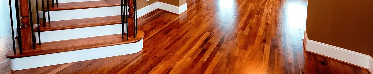 Base floor of a staircase with professionally restored wood flooring in Milwaukee WI