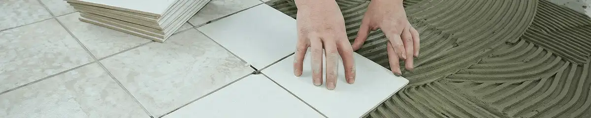 Professional installing white tile floors in Milwaukee, WI
