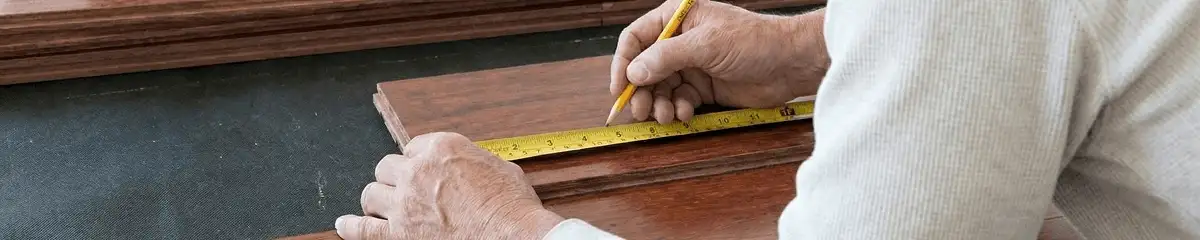 A professional installing wood flooring in Milwaukee, WI